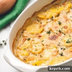 Creamy Homemade Scalloped Potatoes Recipe for Perfect Comfort 2 Baked Scalloped Potatoes in white baking dish.