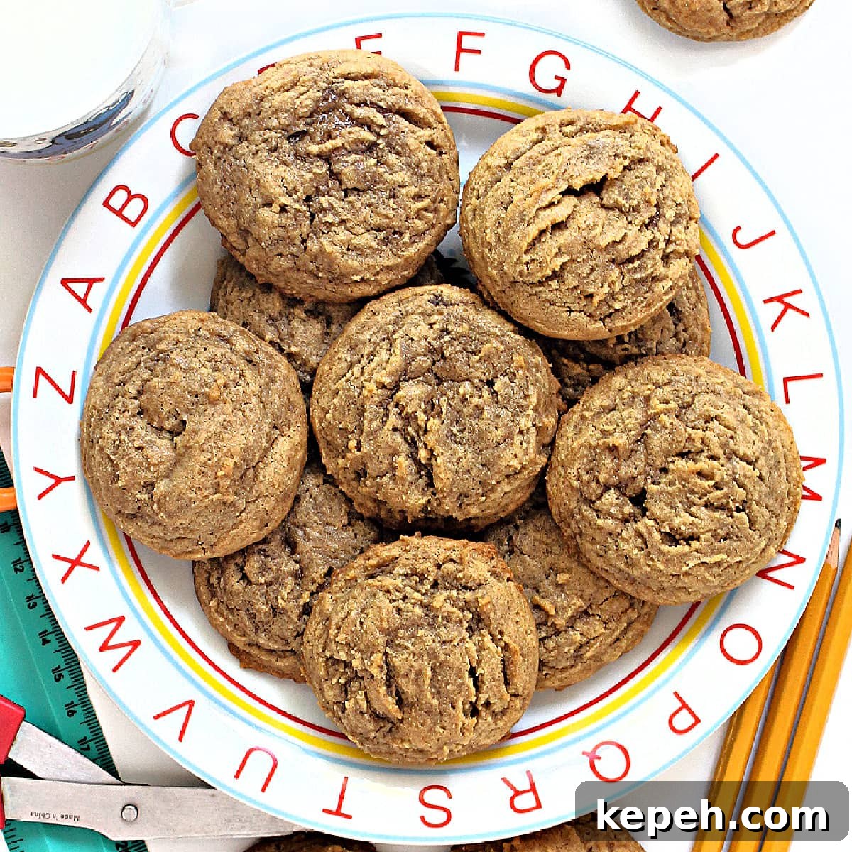 Peanut Butter and Jelly Cookie Recipe: Soft, Jam-Filled Treats 5 Closeup of thick, textured peanut butter cookies on a serving plate with an alphabet rim.