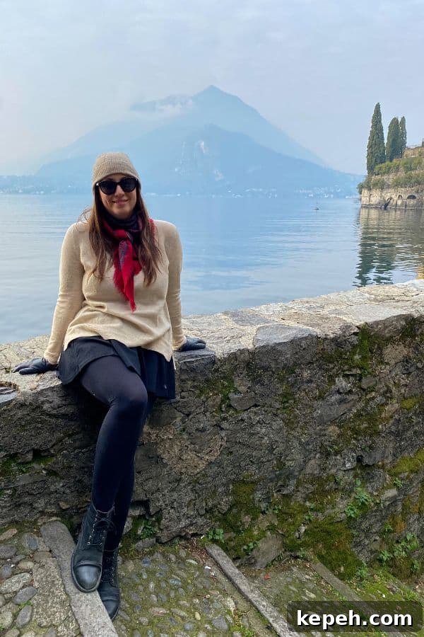 7 Charming Day Trips from Milan: Lakes, Villages & Castles 3 woman sitting on the lake on Lake Como, one of the best day trips from Milan