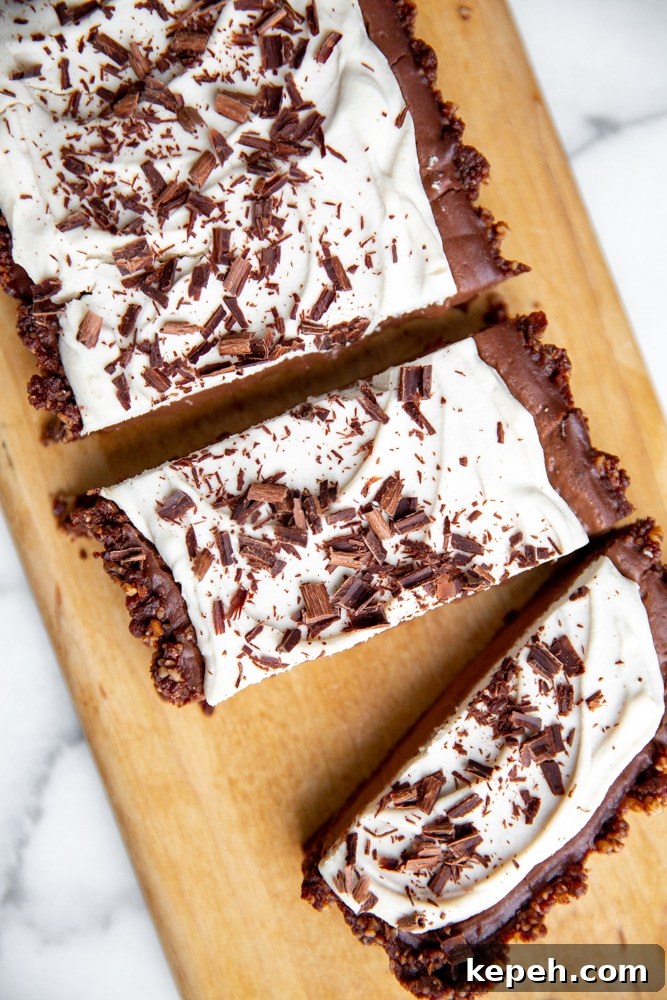 Vegan chocolate tart on a serving board.