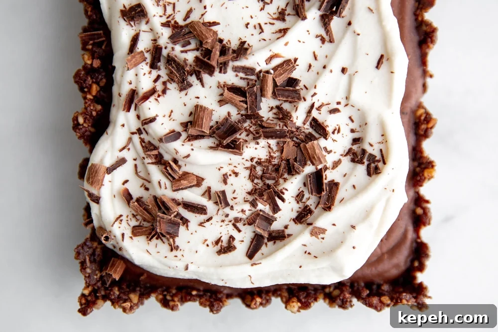 Close up of the no bake chocolate tart topped with chocolate shavings.