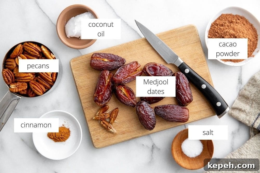 All of the ingredients for the date pecan crust arranged on a marble surface.