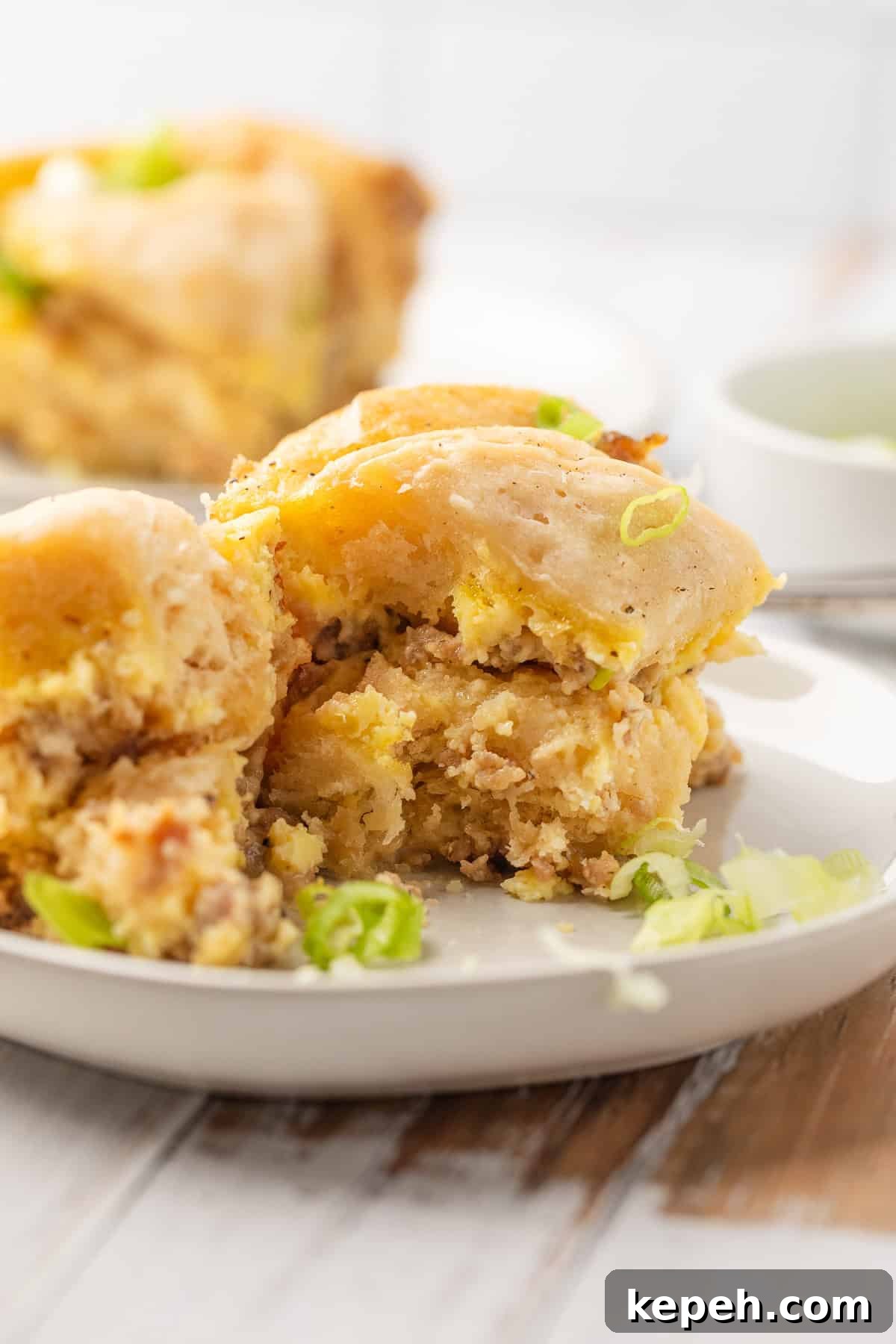 Crockpot Biscuits and Sausage Gravy Casserole 12 Crockpot biscuits and gravy casserole on a plate.