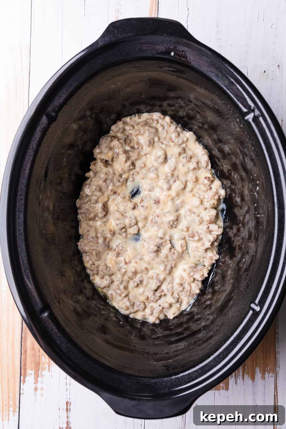 Crockpot Biscuits and Sausage Gravy Casserole 6 A layer of gravy in the crockpot.