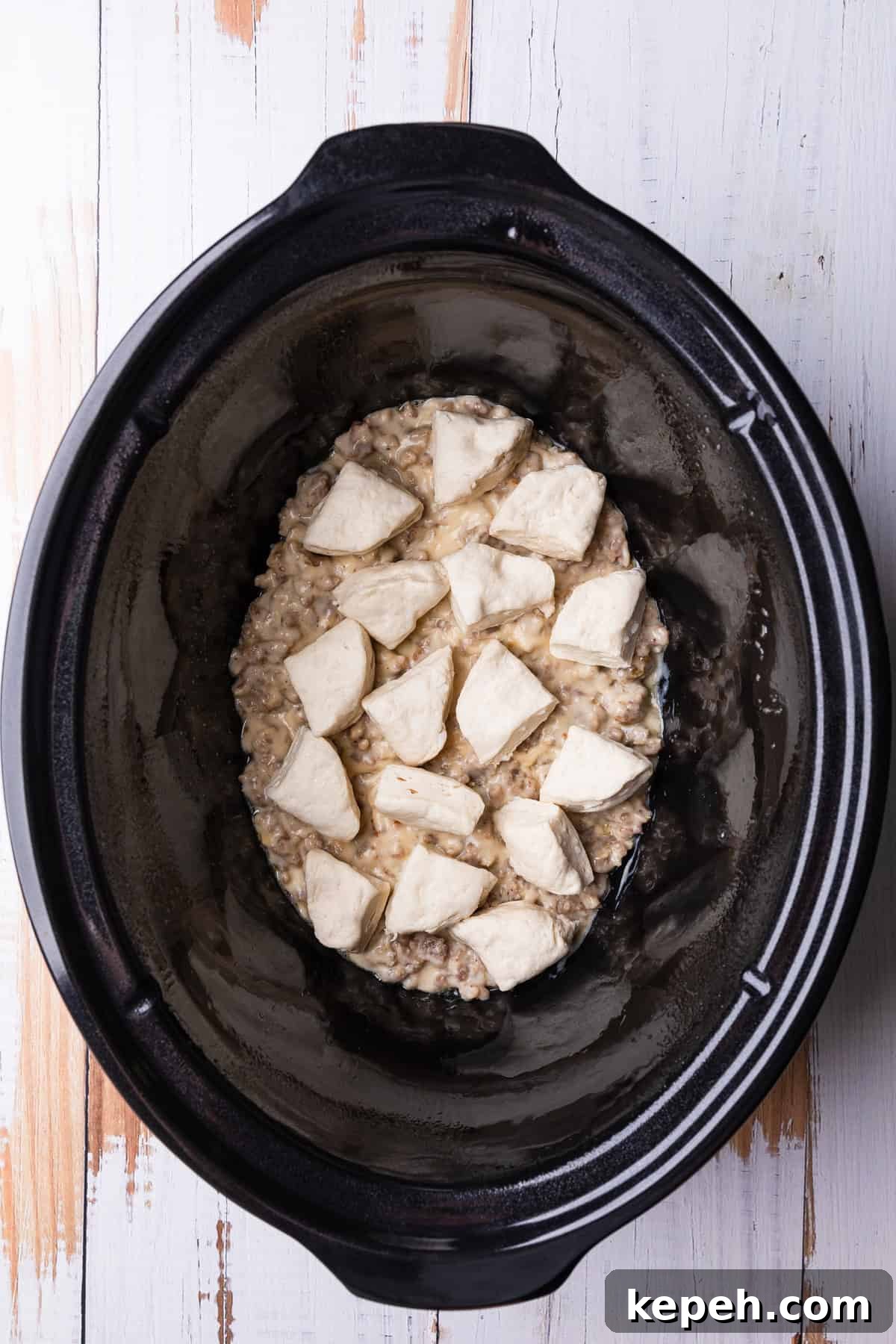 Crockpot Biscuits and Sausage Gravy Casserole 7 The biscuit layer.