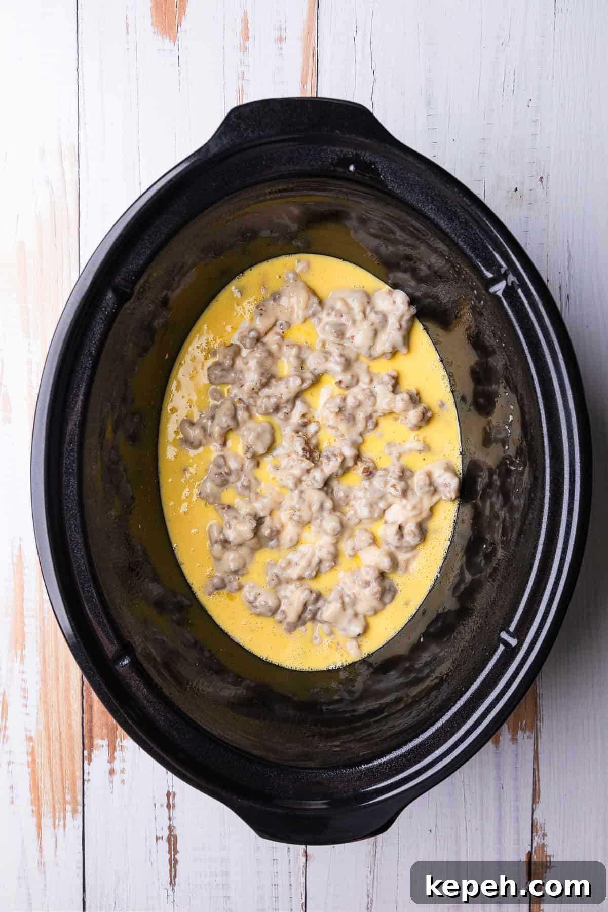 Crockpot Biscuits and Sausage Gravy Casserole 9 Adding another layer of gravy.