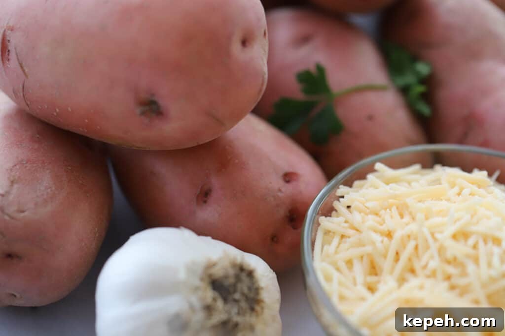 Garlic Parmesan Mashed Potatoes Recipe – Creamy, Savory Side Dish 5 whole red potatoes, a whole head of garlic and a ramekin of shredded parmesan cheese to make garlic parmesan potatoes.