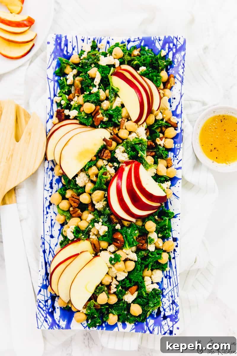 Overhead shot of chickpea salad on a long blue plate.