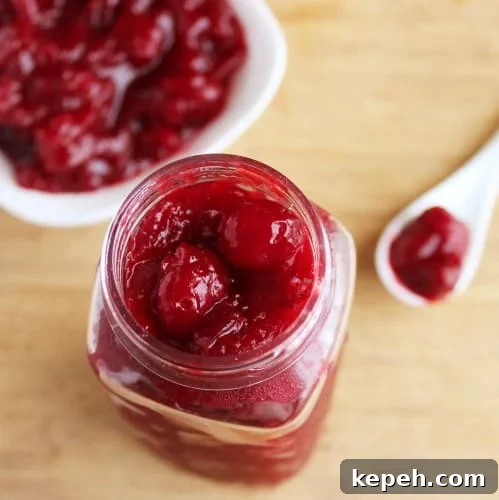 Top down shot of cranberry orange sauce in a jar. 