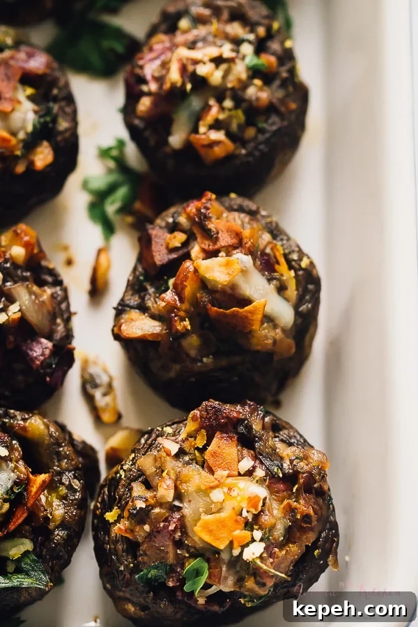 Overhead view of stuffed mushrooms in a baking dish. 