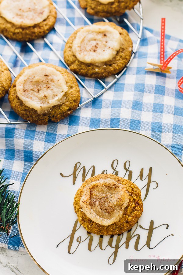 Top down view of pumpkin sugar cookies on a plate and a wire rack.