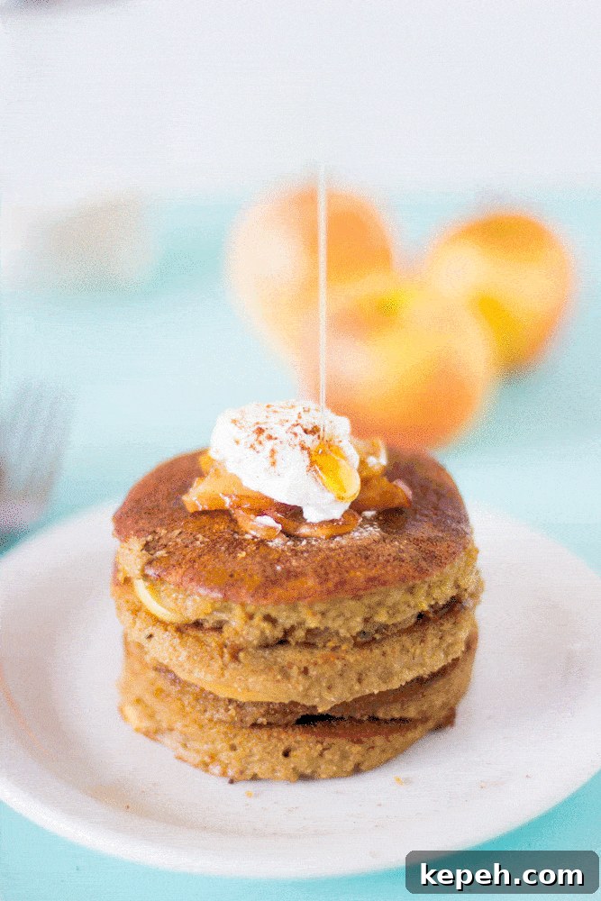 Apple pie pancakes drizzled with syrup. 
