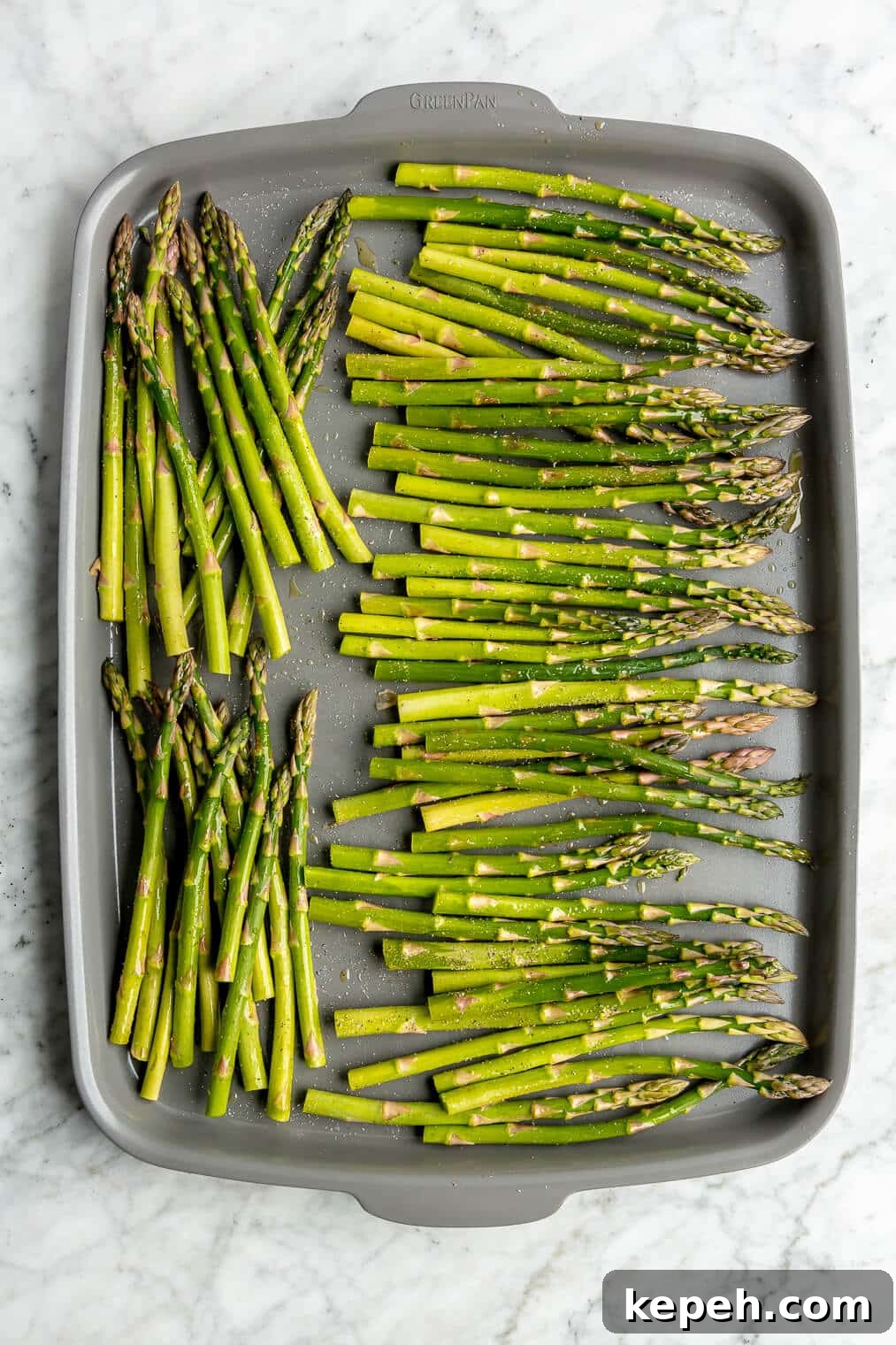 Roasted Asparagus with Lemon Cardamom Cream Sauce 6 Raw asparagus on a sheet pan.