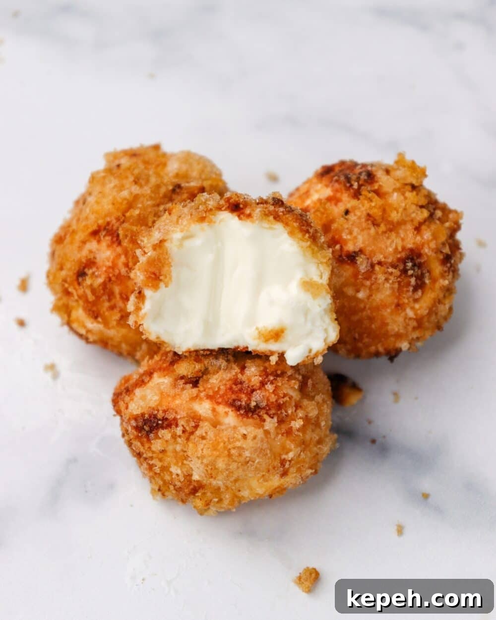 Air Fryer Crispy Carnivore Cream Cheese Bites with bite taken out