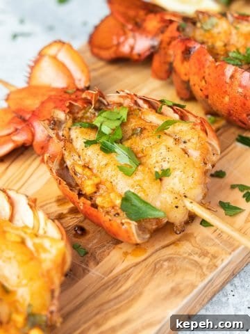 Smoked lobster tails on cutting board seasoned