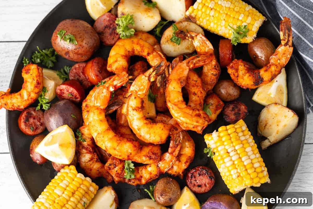How to Smoke Shrimp Perfectly: Simple Steps for Juicy Flavor 23 Smoked shrimp on platter surrounded by corn on the cob and potatoes.