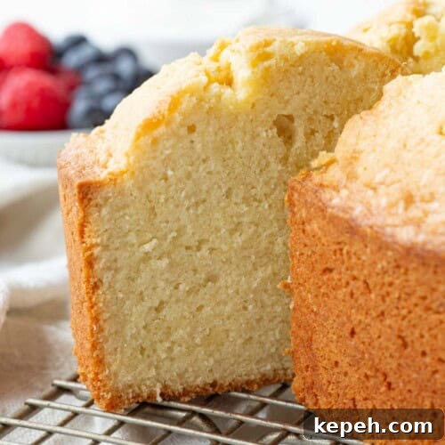 slice of pound cake poking out of a whole pound cake.