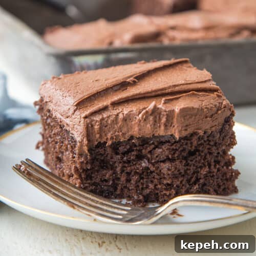 slice of chocolate mayonnaise cake with a bite taken out.