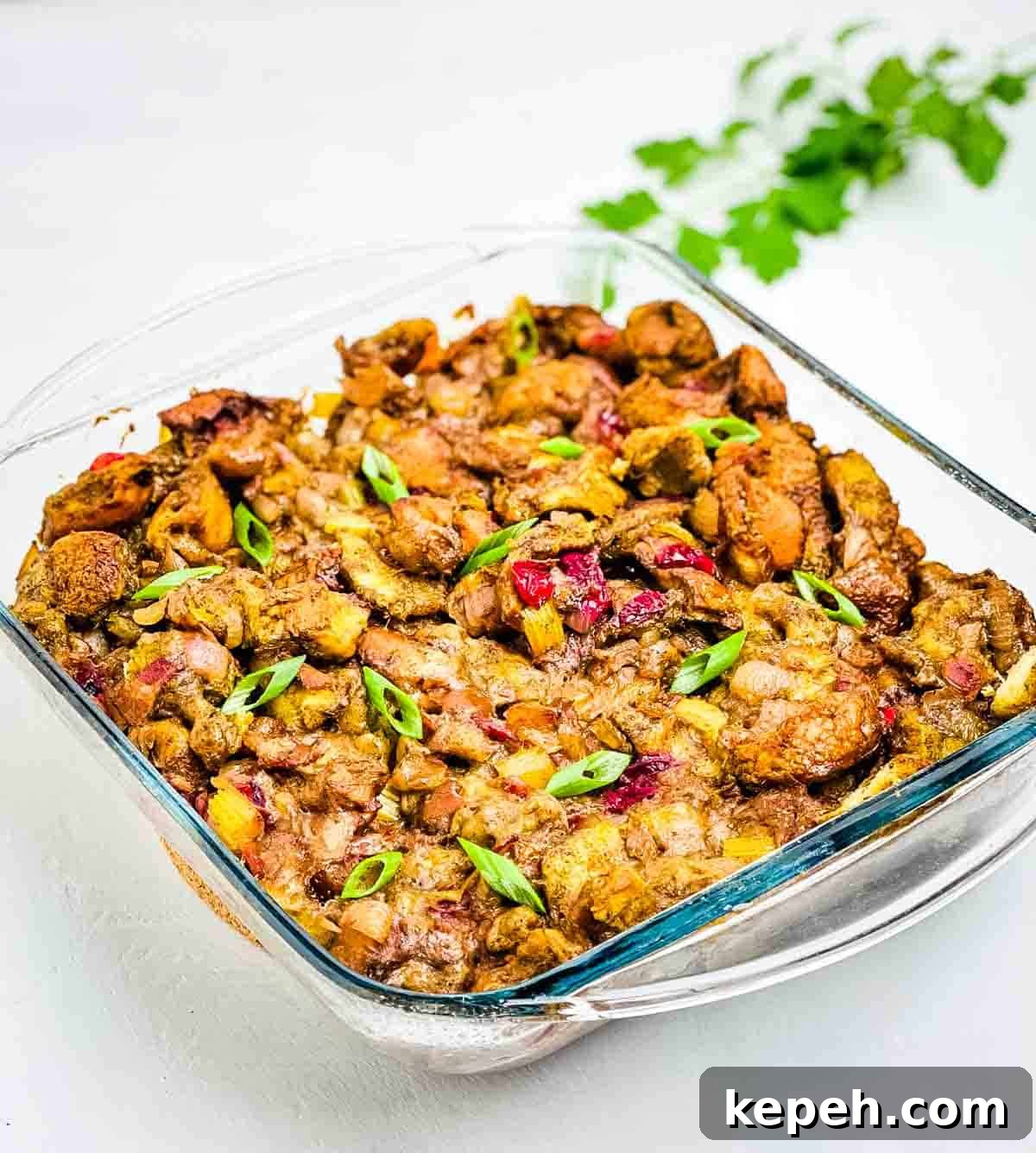 Bacon and Cranberry Stuffing Recipe for Holiday Tables 11 A closeup of the homemade stuffing in a baking dish.