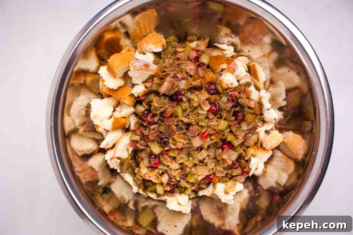 Bacon and Cranberry Stuffing Recipe for Holiday Tables 7 The bacon mixture poured over the bread cubes.