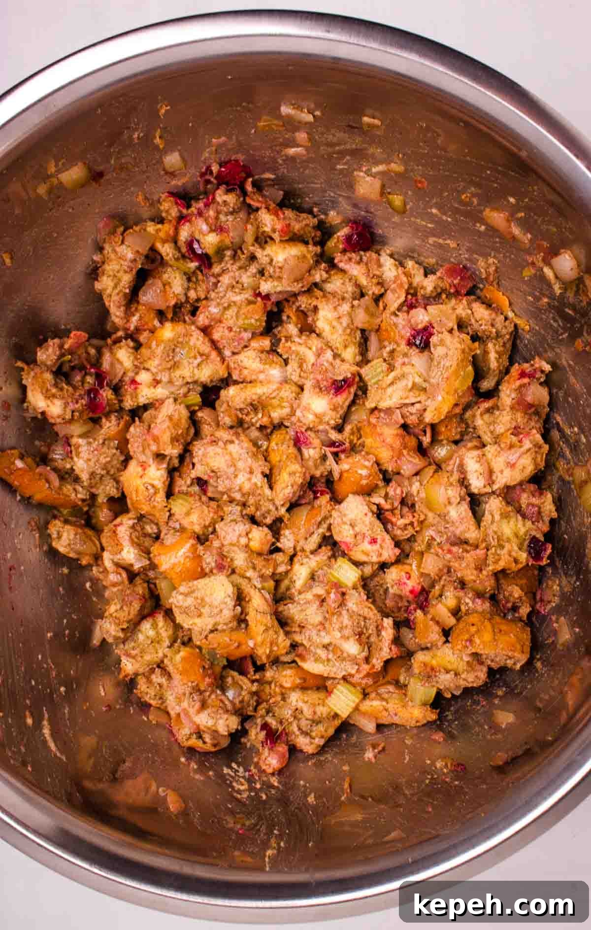 Bacon and Cranberry Stuffing Recipe for Holiday Tables 8 The stuffing mixed together in a large bowl.