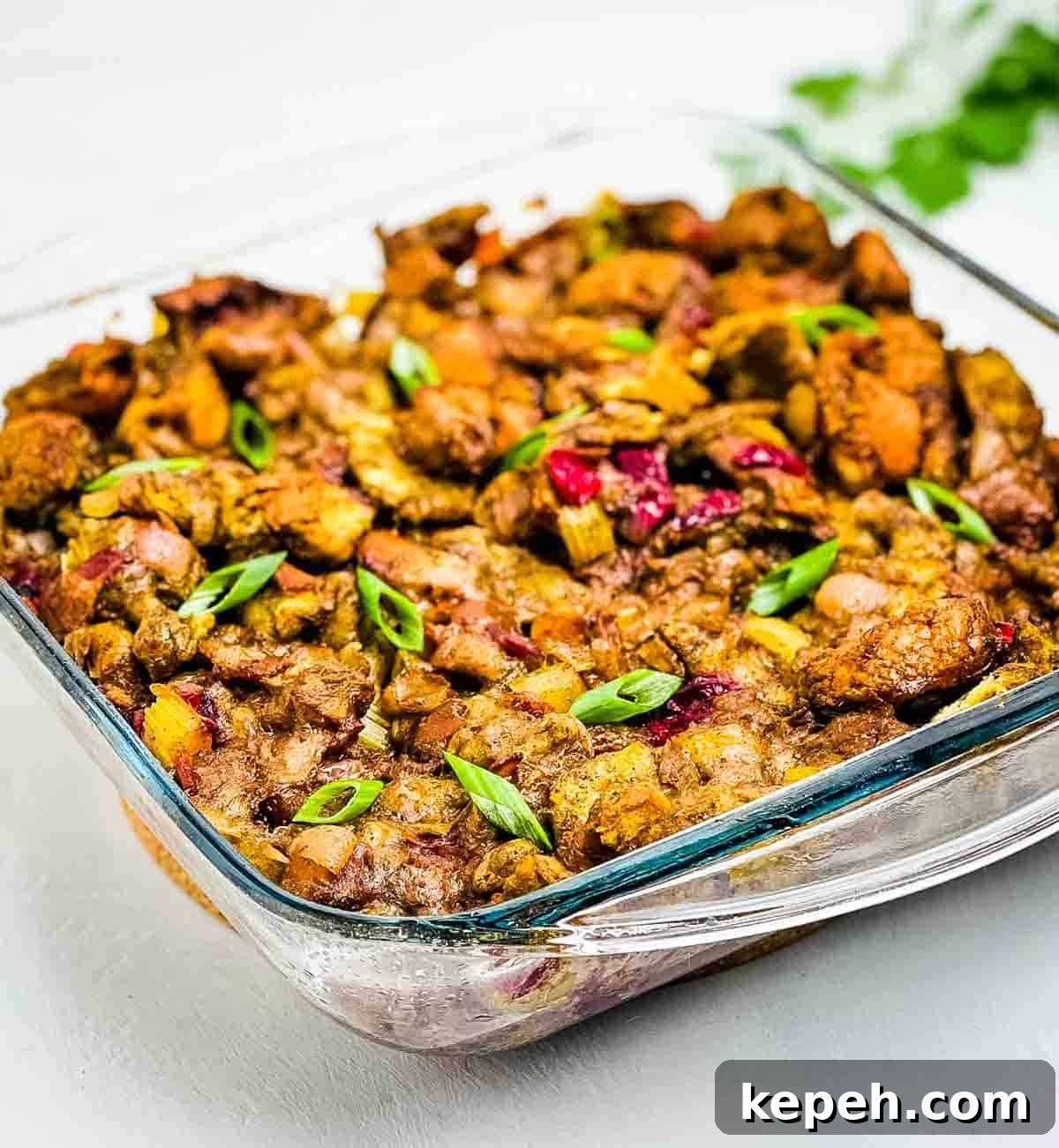 Bacon and Cranberry Stuffing Recipe for Holiday Tables 9 The homemade stuffing in a glass baking dish.