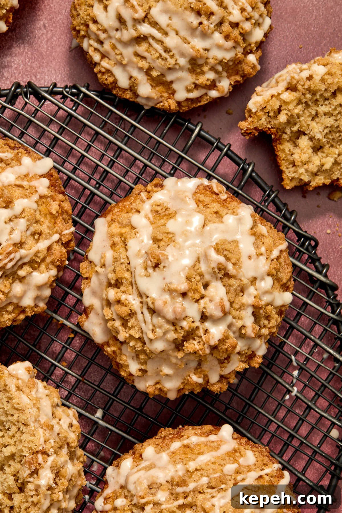 Spiced Eggnog Muffins with Streusel and Eggnog Glaze Recipe 14 Overhead of muffins on a wire rack and topped with glaze.
