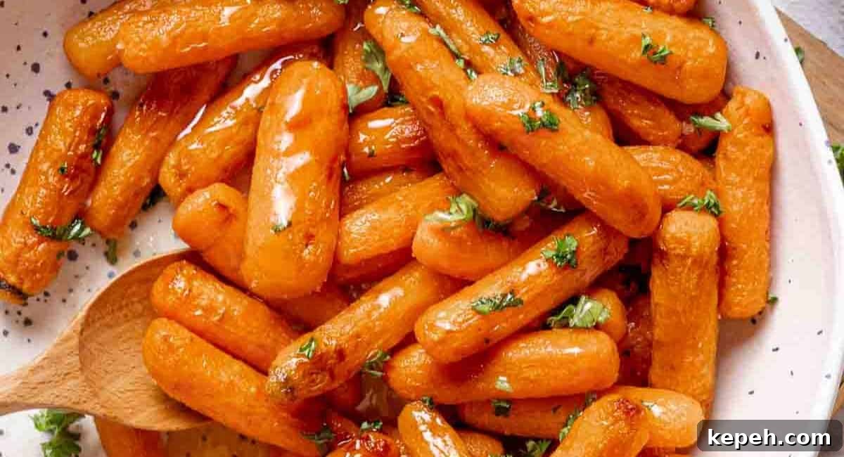 Overhead image of air fryer baby carrots in bowl.