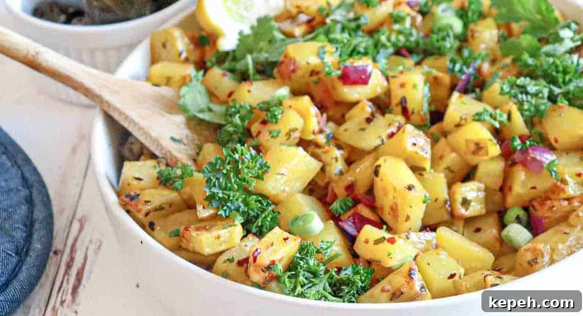 Up close image of batata harra with garnish.
