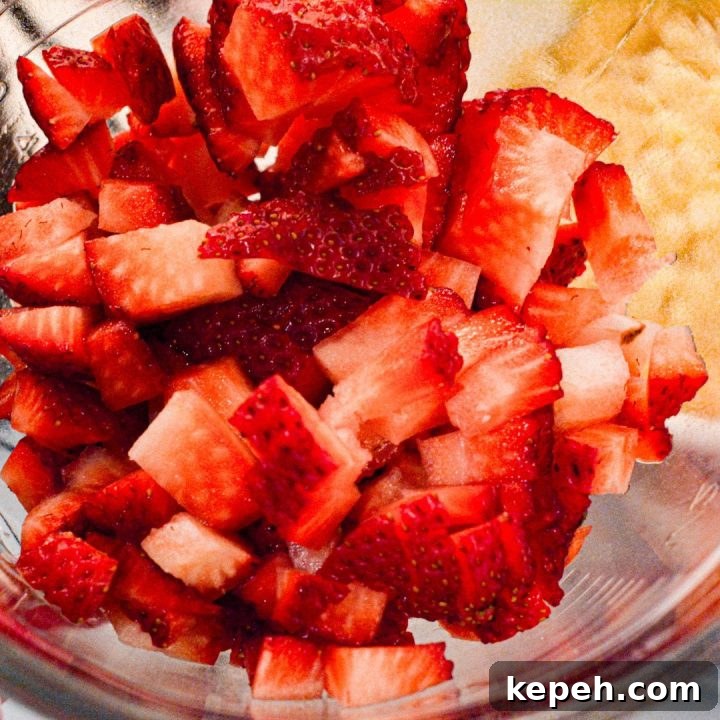 Strawberry Cheesecake Cookie Recipe: Soft Baked Strawberry Swirls 8 With a spatula, mix in the white chocolate chips and diced strawberries into the cookie dough.