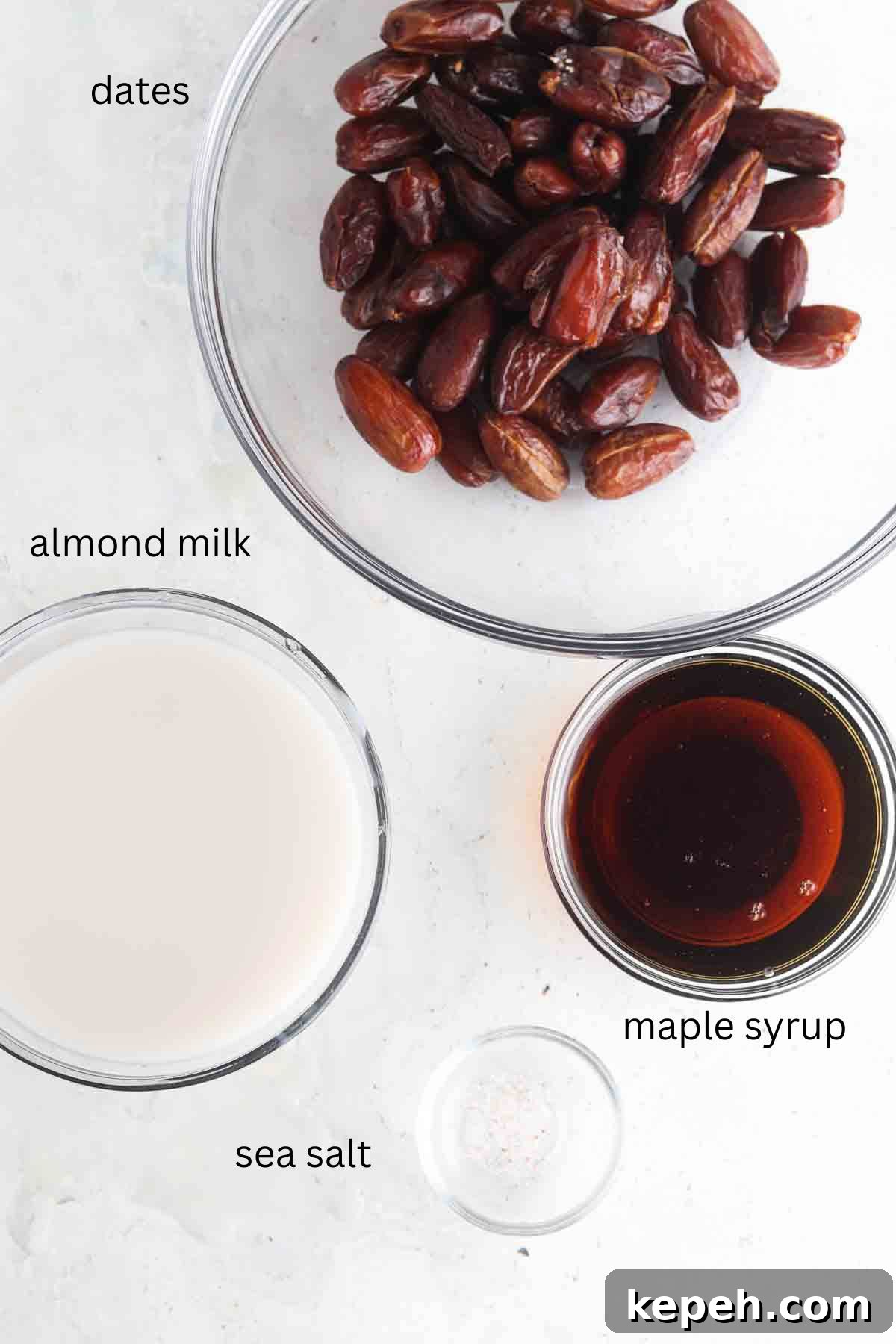Creamy Vegan Fruit Dip Recipe for Parties and Snacks 3 Date, coconut milk, maple syrup and salt sitting out in glass bowls.