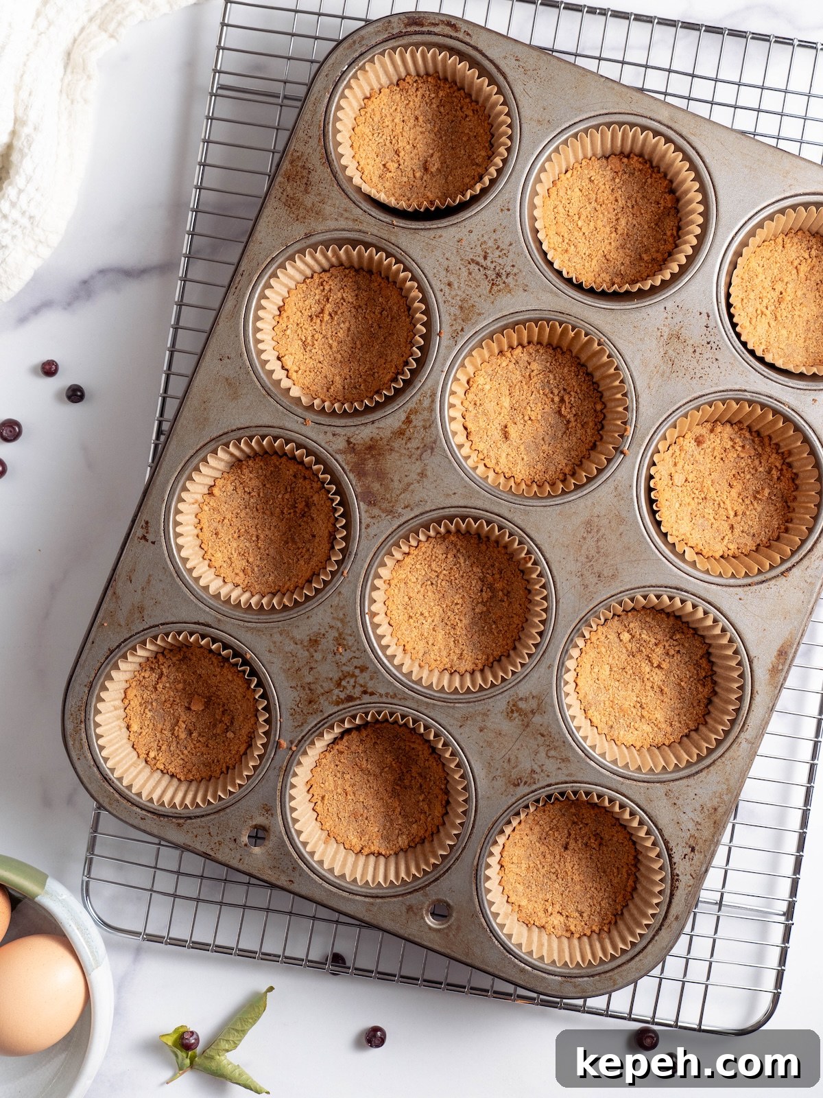 Mini Huckleberry Cheesecake Bites: Tangy Dessert Recipes 3 Graham cracker crusts, baked in a muffin tin