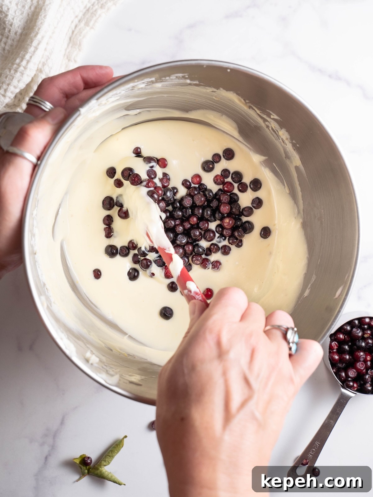 Mini Huckleberry Cheesecake Bites: Tangy Dessert Recipes 4 Folding wild huckleberries into cheesecake batter
