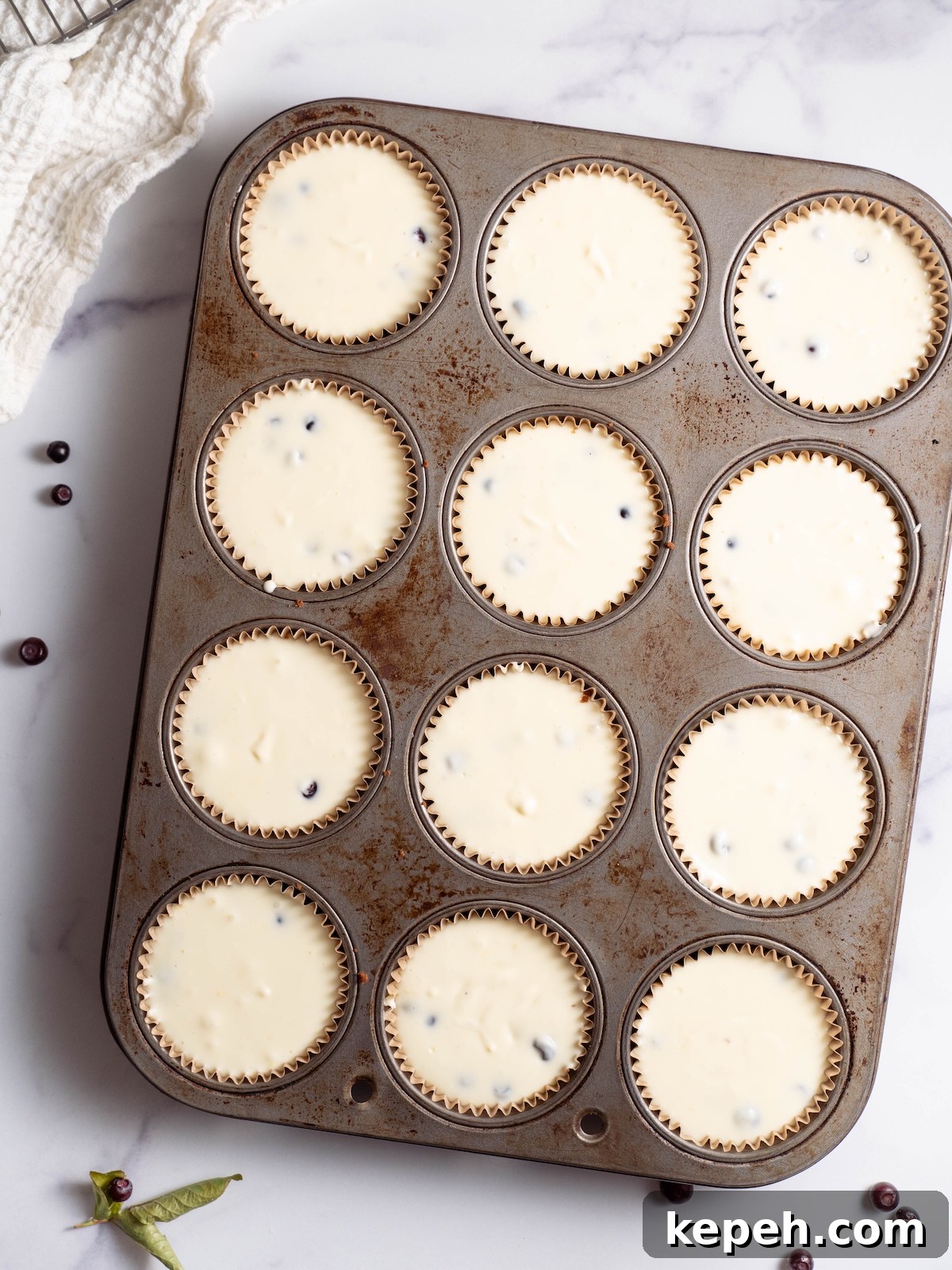 Mini Huckleberry Cheesecake Bites: Tangy Dessert Recipes 5 Mini cheesecakes before baking