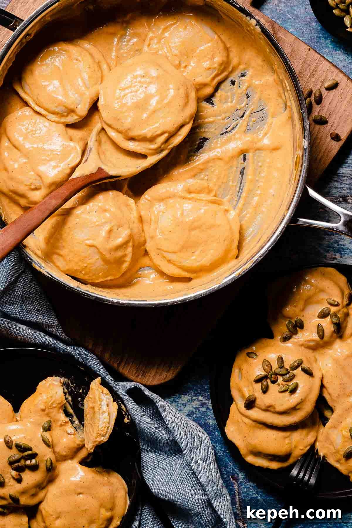 creamy pumpkin ravioli in pan and on two plates