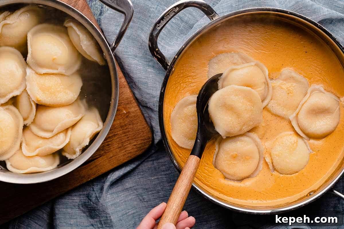 cooked ravioli being added to pan of pumpkin cream sauce