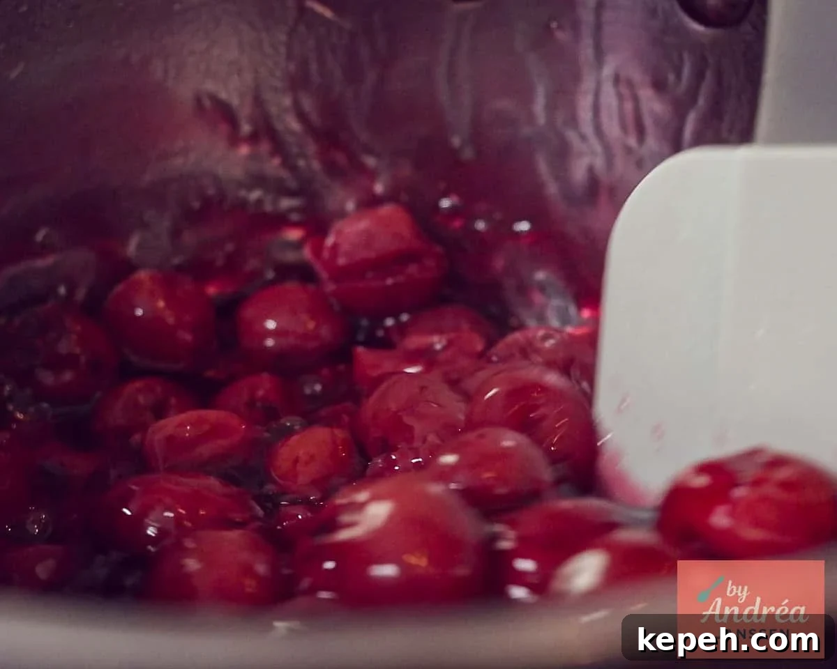 Cherries are added to the pan and stirred
