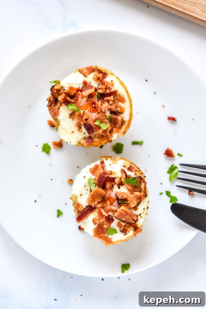 Tater Tot Crust Baked Egg Cups: Crispy Potato Breakfast Cups 10 two tater tot crust baked egg cups on a white plate.