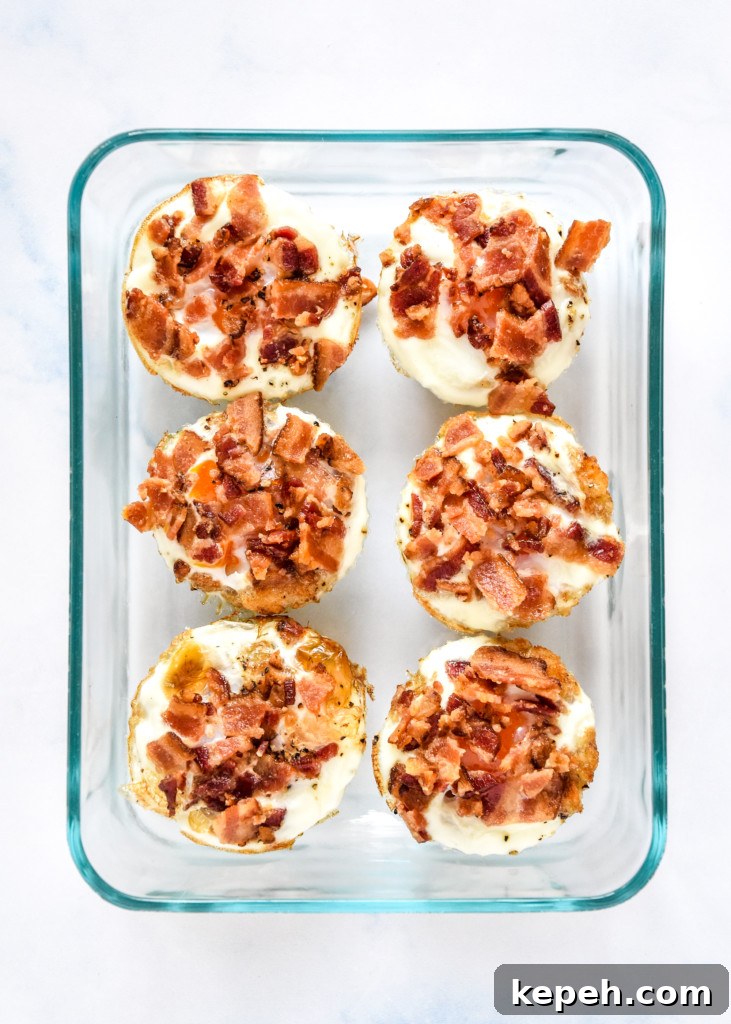Tater Tot Crust Baked Egg Cups: Crispy Potato Breakfast Cups 15 tater tot crust baked egg cups in a glass meal prep container.