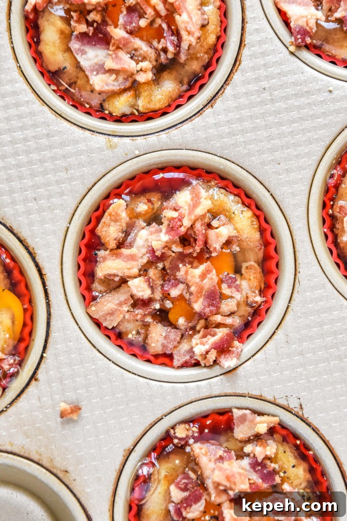 Tater Tot Crust Baked Egg Cups: Crispy Potato Breakfast Cups 8 tater tot crust baked egg cup close up before baking.