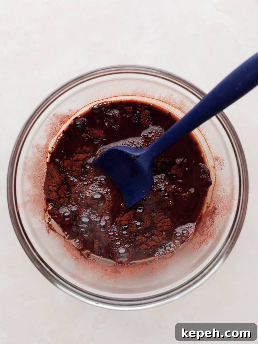 Gluten-Free Chocolate Snack Cake Recipe for Quick Treats 5 a bowl with bloomed cocoa powder