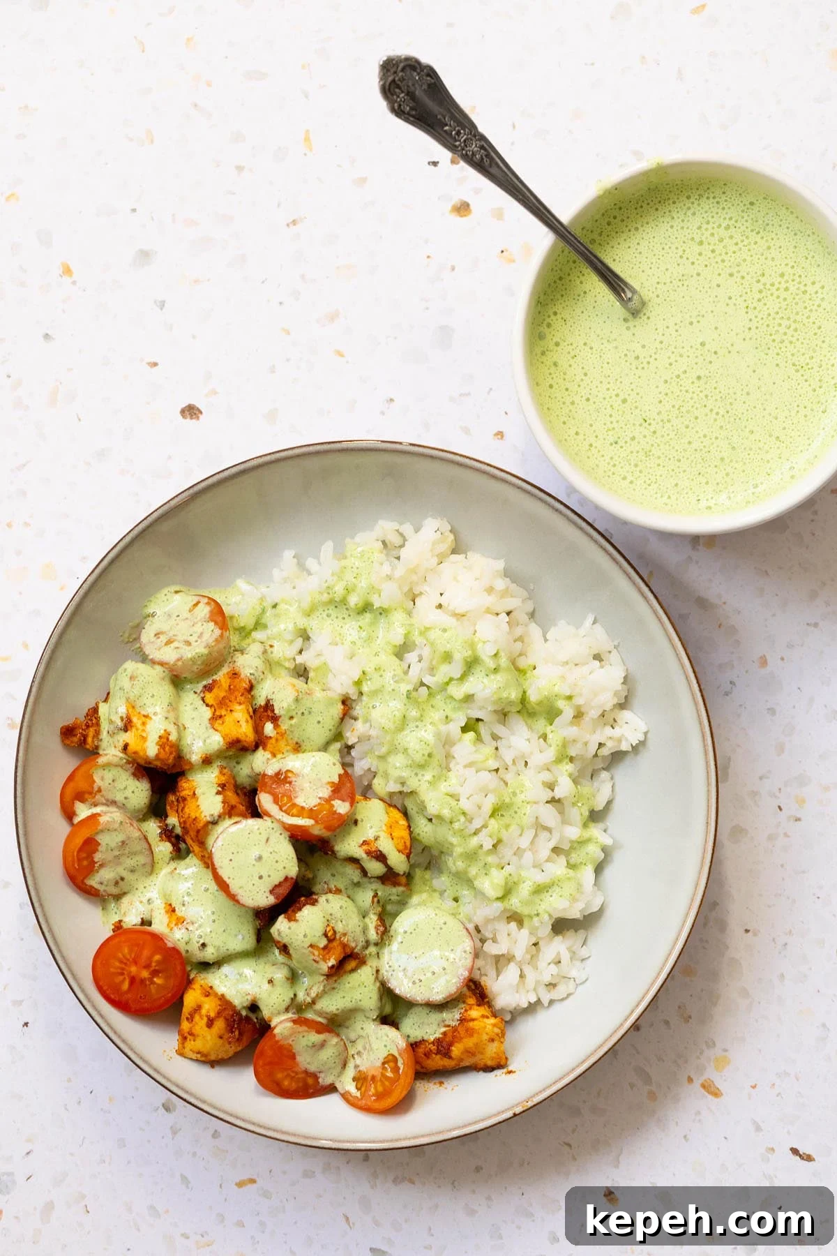 Creamy Mint Yogurt Sauce Recipe for Grilled Meats and Dips 2 Yogurt mint sauce topping chicken and rice