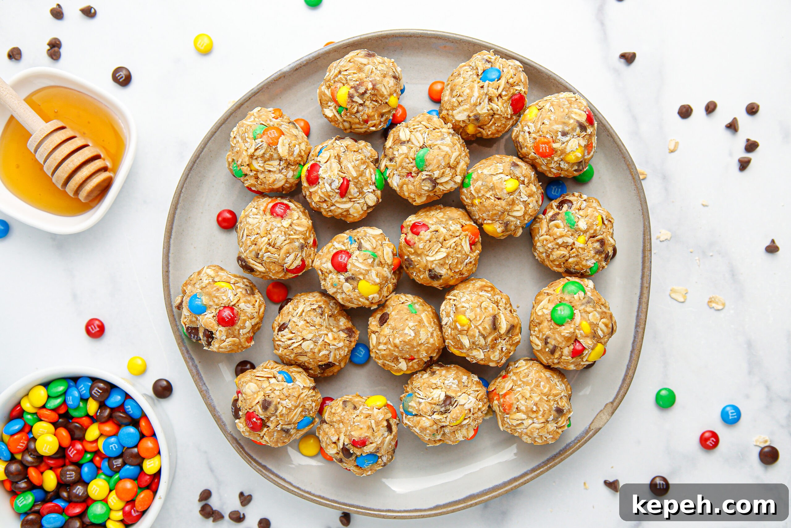 No-Bake M&M Energy Bites: Chocolate Peanut Butter Snack Balls 6 overhead view of No Bake M&M Energy balls on a large gray plate