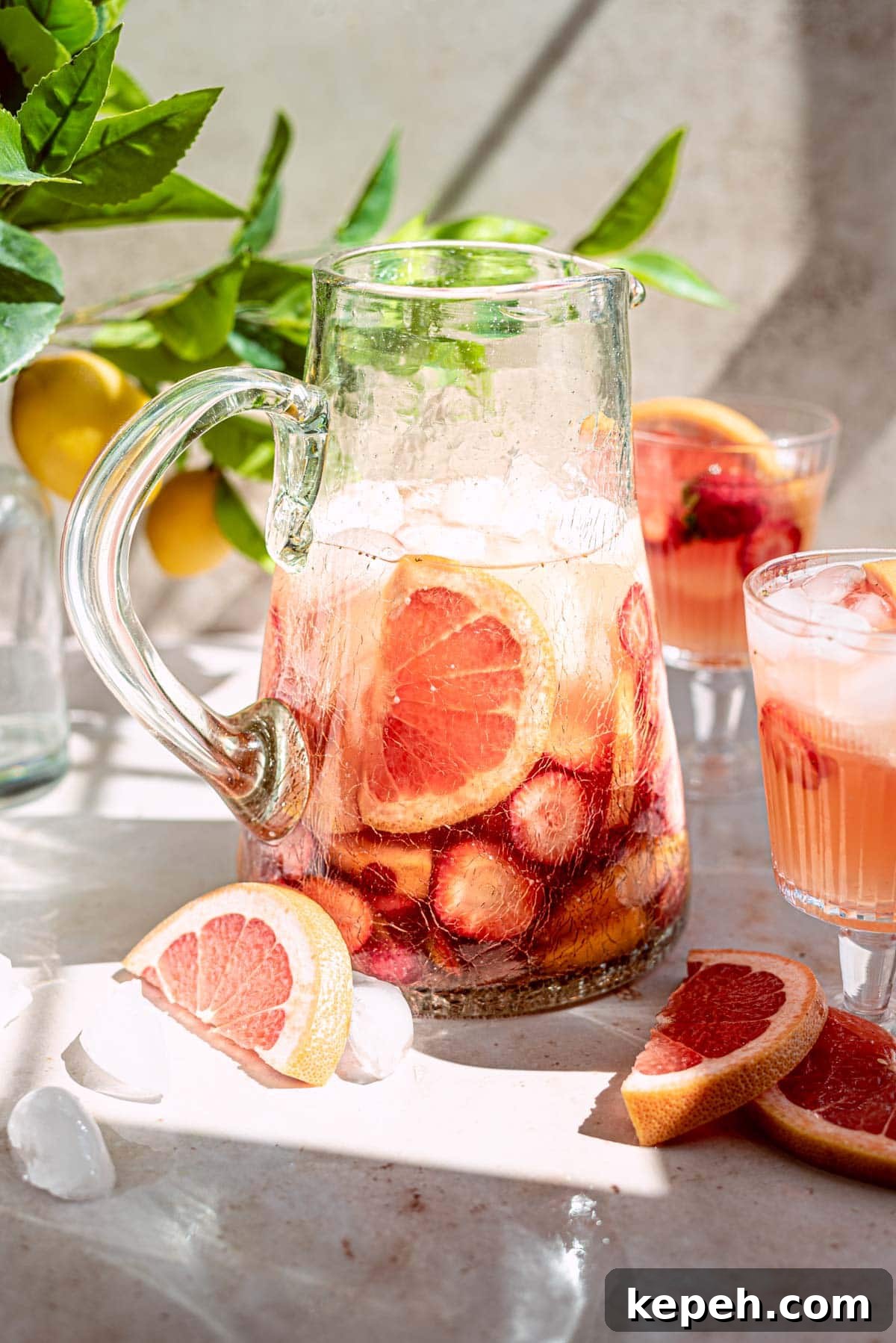 27 Refreshing Summer Punch Recipes to Keep Your Party Cool 27 pink rose grapefruit sangria