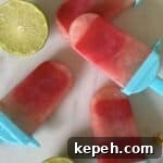 Watermelon Popsicles on granite with limes