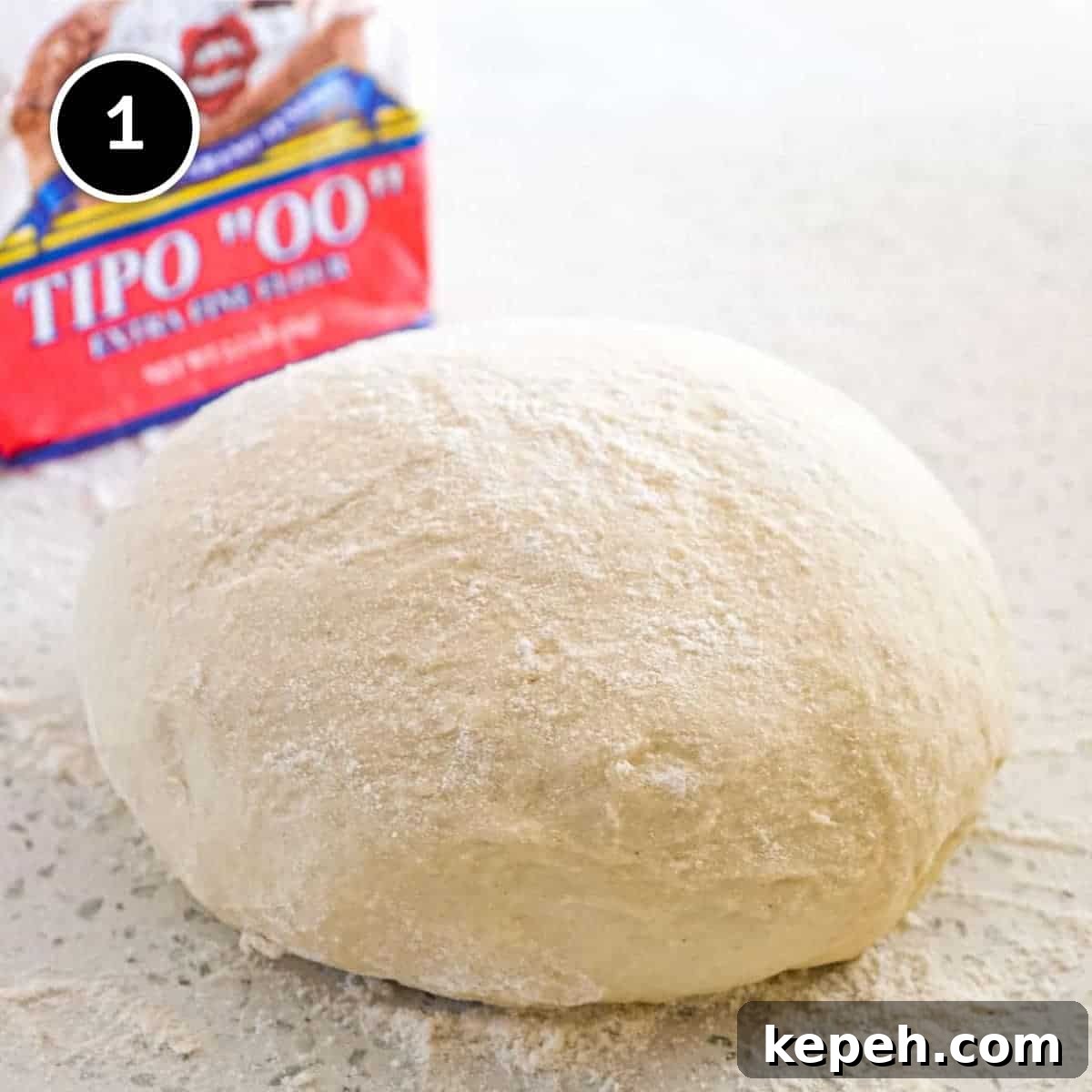 Panzerotti (mini calzone pizza with tuna & red peppers) | www.cookeatworld.com A ball of Panzerotti Pizza dough