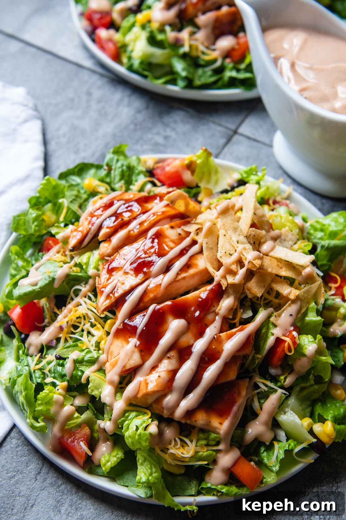 5-Minute BBQ Ranch Sauce & Dressing Recipe 4 a salad with bbq ranch dressing drizzled on top.