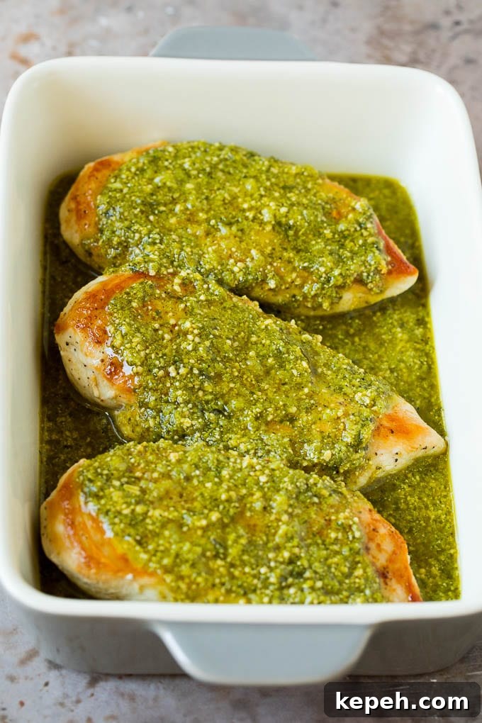 Chicken breasts covered in a pesto sauce. Chicken breasts covered in a pesto sauce.