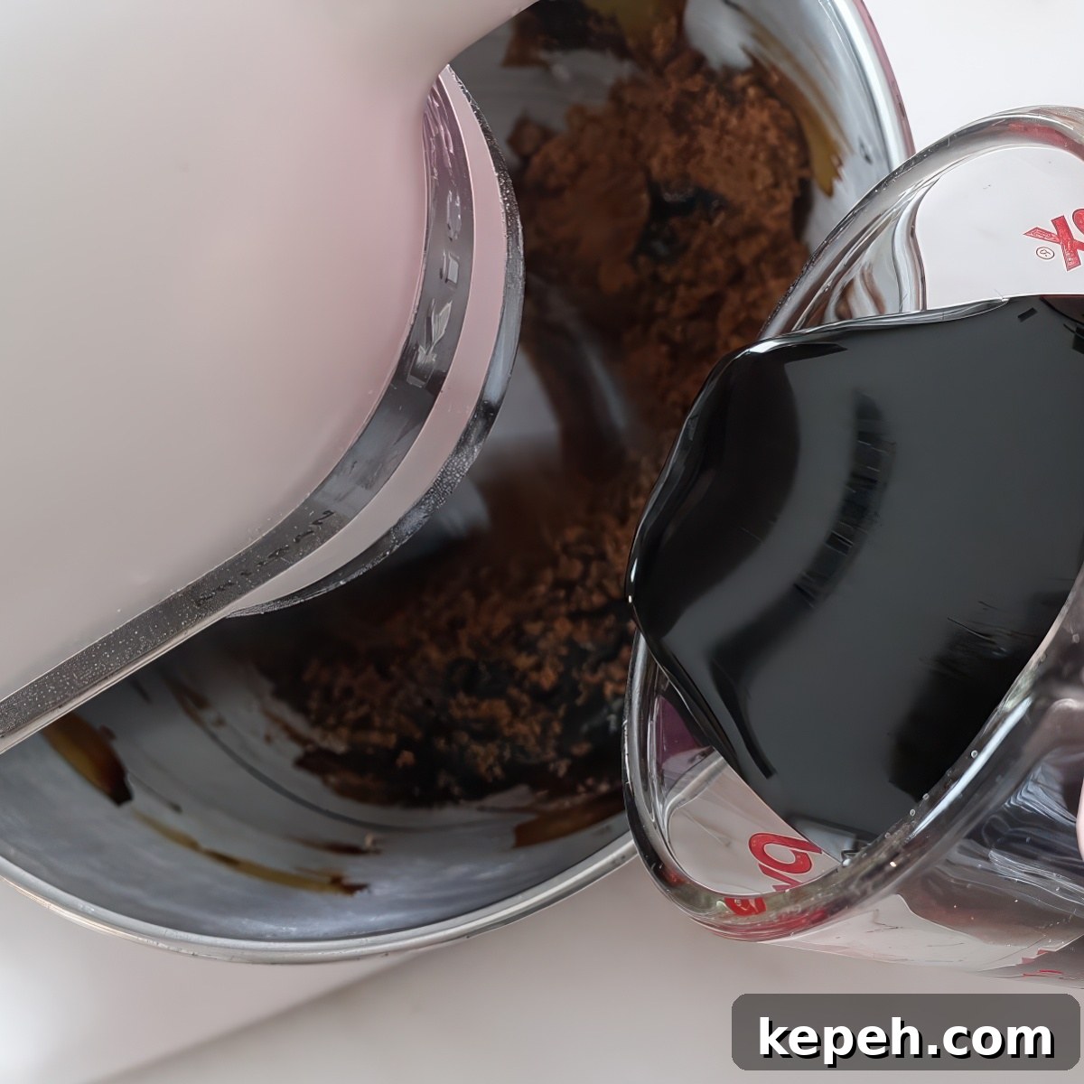 Gluten-Free Gingerbread Loaf Recipe That Delights 6 pouring molasses into brown sugar in a stand mixer.
