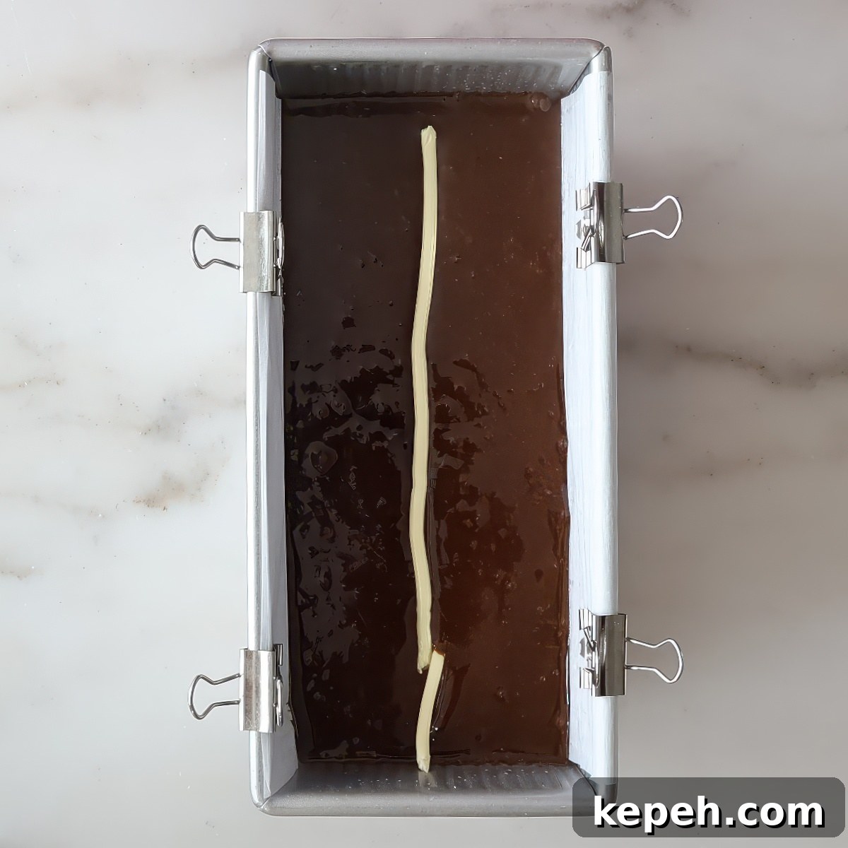 Gluten-Free Gingerbread Loaf Recipe That Delights 9 softened butter line piped in center of batter in loaf pan.